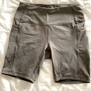 Olive green biker shorts with pockets